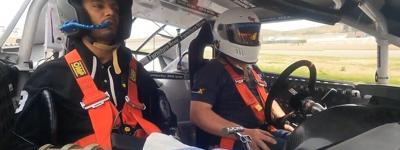 Man paralyzed from waist down uses microchip implanted in brain to drive race car