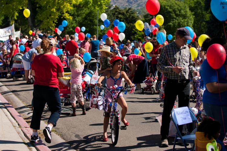 Families march down Provo's Center Street in Children's Parade