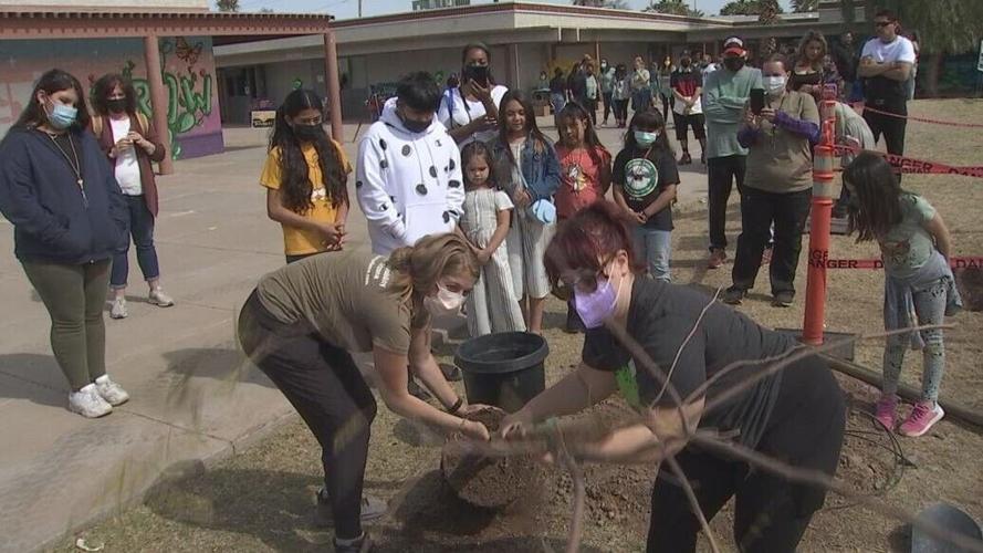 Students, staff plant 100 trees to celebrate Emerson Elementary centennial