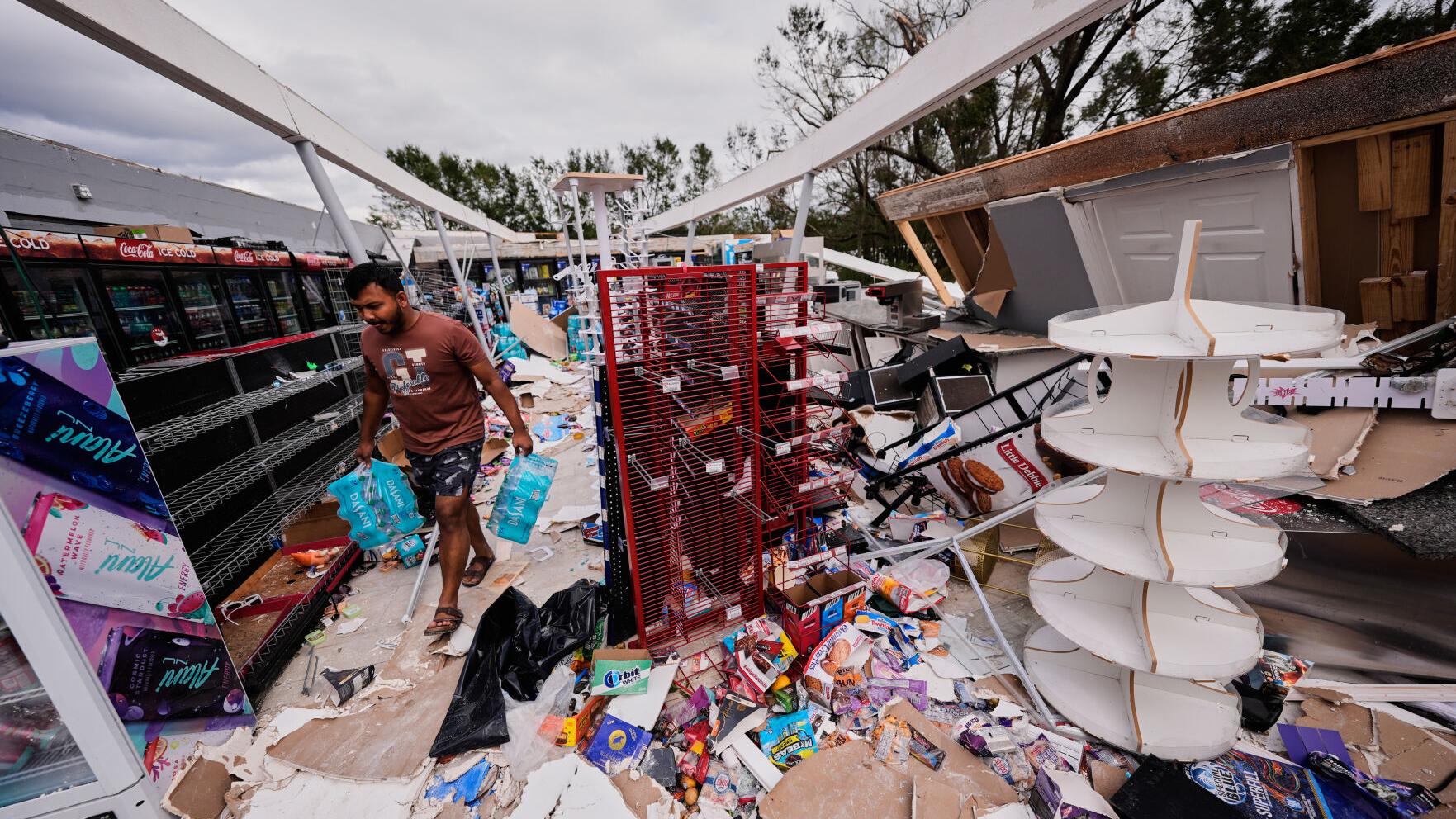 Isaias leaves trail of damage as it moves inland, in photos